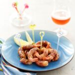 Gamberoni con prosciutto e birra